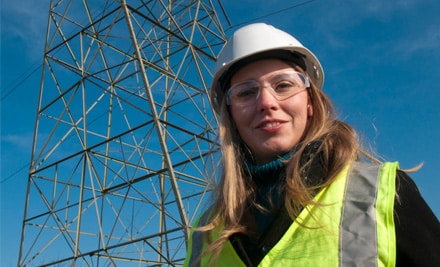 PPL utility worker standing in front of an electrical tower