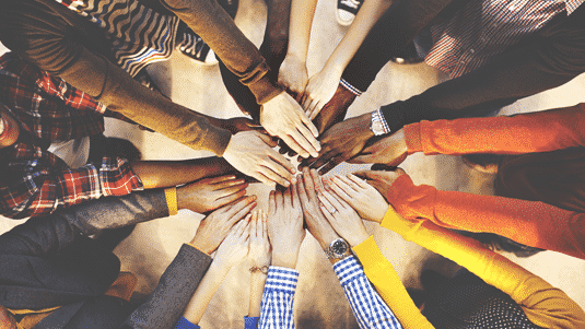Multicultural hands forming a circle