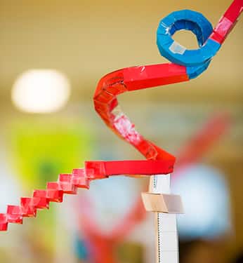 Close of of colorful paper rollercoaster, created by students at Broughal Middle School