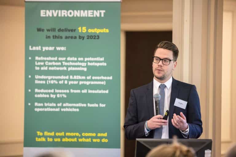 Alex Wilkes speaking at environmental summit