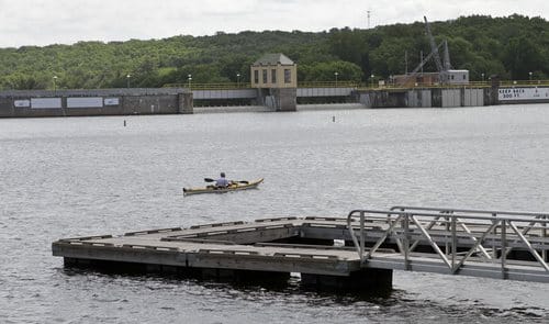 A kayaker paddles past the Lake Wallenpaupack hydroelectric dam. Photo courtesy of The...