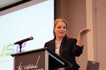 PPL employee speaks at a podium during a conference