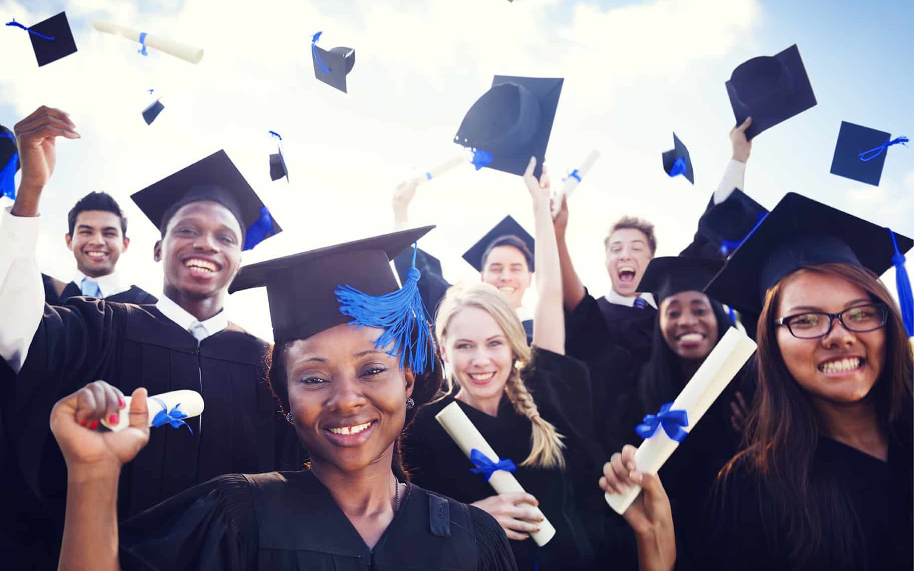 Students graduating with diplomas