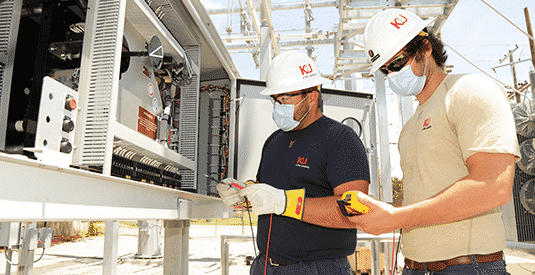 KU employees work at substation
