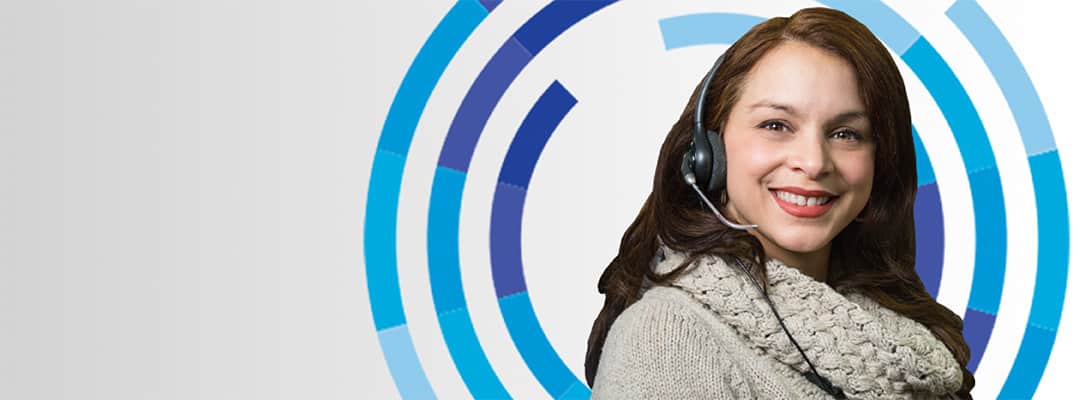 Photo of a Hispanic female customer service employee smiling.